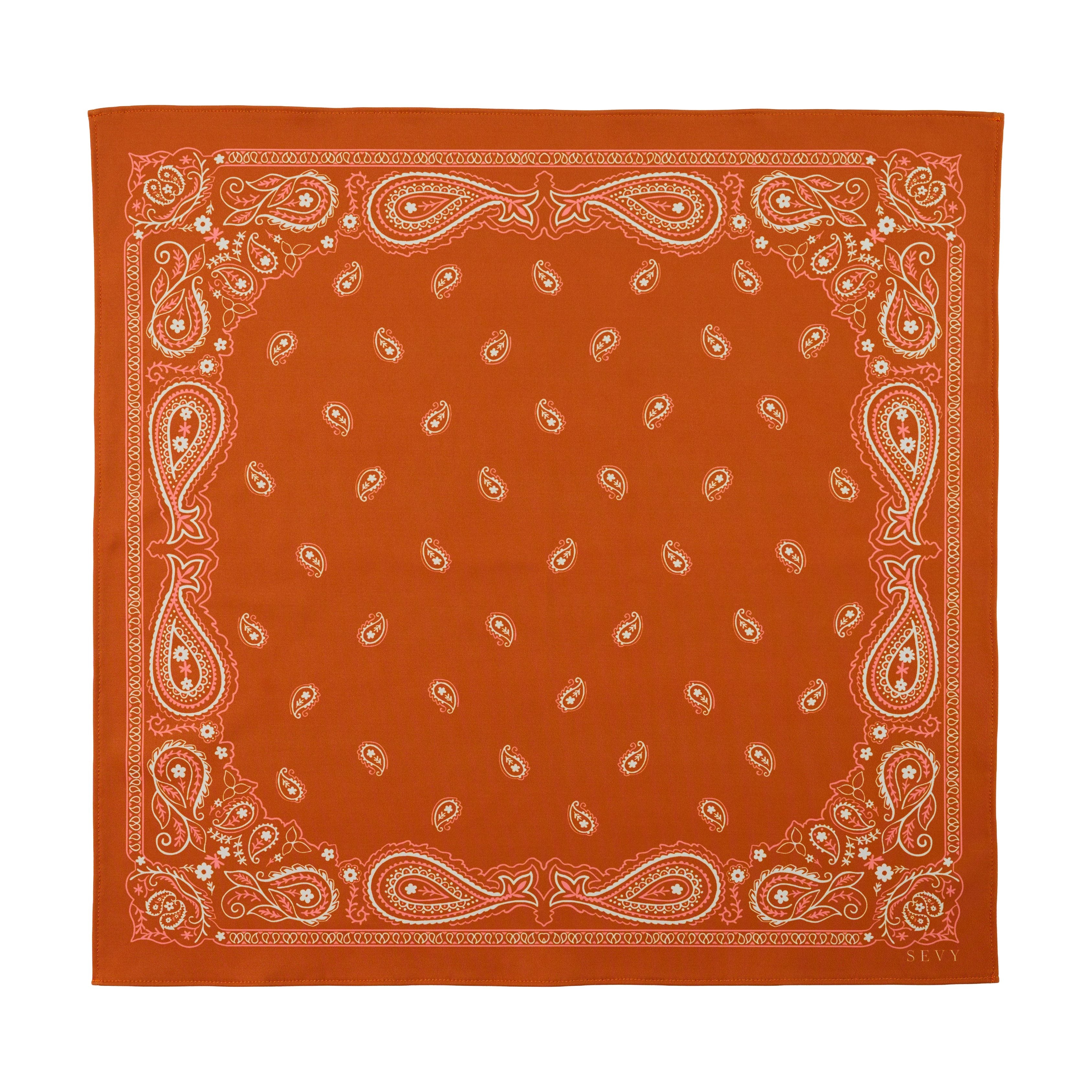 Sea Ranch Sunwear Bandana in Bonfire burnt orange paisley, laid flat, SEVY Tailgate collection