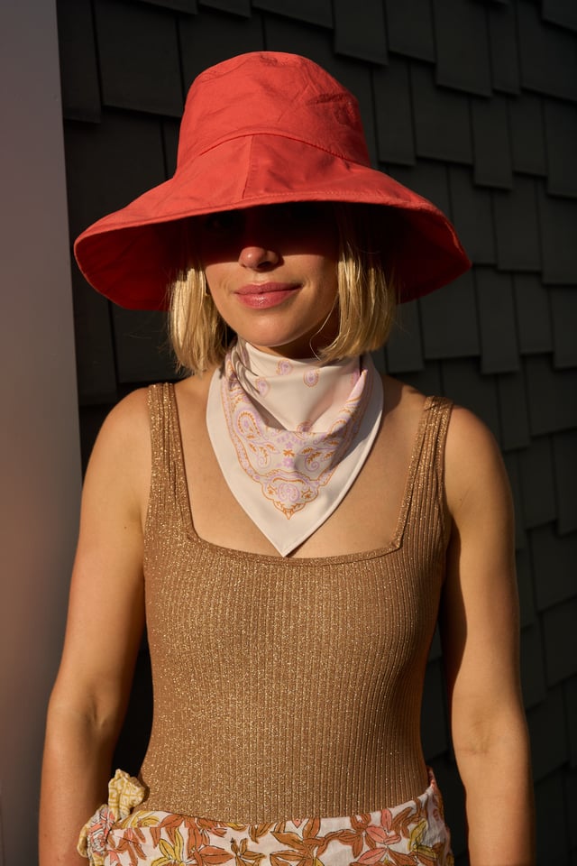 Woman wearing the Sevy Sea Ranch UPF 50+ sun bandana in Sunset